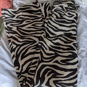 Divided zebra print jeans
